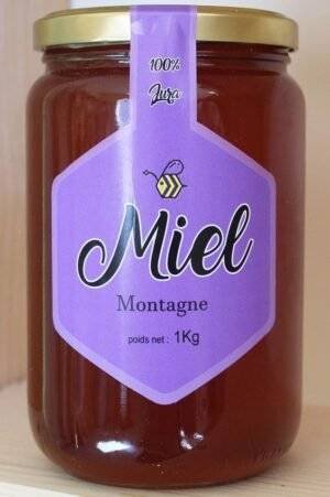 Un pot de 250g de miel de montagne du Jura, une gourmandise rare et précieuse